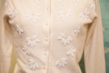 Ivory lambswool angora sweater, intricate white beaded leaves and pearl buttons.