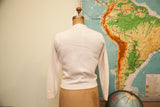 Back view of the vintage ivory lambswool angora sweater with ribbed trim.