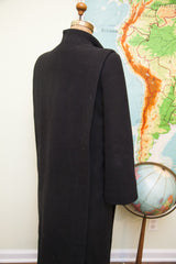 Vintage Trigere black wool coat, showing tailored back and sculpted shoulder.