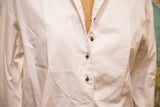 Textured bib and dark button placket on a vintage white Geoffrey Beene shirt.