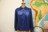 Lustrous vintage Mr Beene silk blouse with blue and black checker pattern.