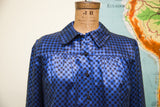 Blue and black checker silk blouse, featuring collar and gathered upper front.