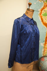 Shimmering blue and black checker pattern on vintage Mr Beene silk blouse.