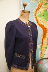 Vintage Linda Hutley navy blue sweater with patterned trim, gold buttons, and puffed sleeves.