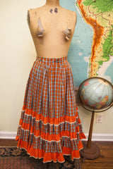 Vintage 50s squaredancing skirt in orange and blue plaid with tiered lace ruffles.
