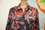 Moschino buttondown blouse with vibrant red floral pattern and script logo.