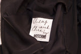 Cheap and Chic by Moschino's white designer label, showing Made in Italy.