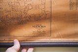 Monochromatic 1930s Newburgh map title with Hudson River text, tan discoloration, wooden edge.