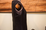 Tailored shoulder and sleeveless armhole detail of the vintage black Mancini dress.