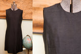 Full view and close-up of the vintage black Mancini dress, showing the texture of the silk fabric.