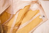 Carole King Junior Fashions tag inside vintage pink dress with tan lining.