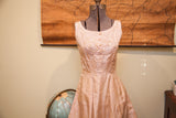 Vintage 50s pink taffeta dress featuring a full skirt and delicate sequin work.