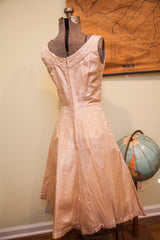 Back view of vintage 50s Carole King pink taffeta dress with sequin trim.