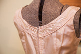 50s pink taffeta dress back, zipper closure, and iridescent sequin trim.