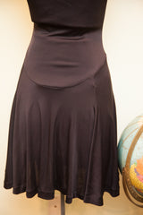 Betsey Johnson black dress, curved waist seam, and ballerina-style skirt.