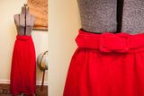 Red velvet Nelly De Grab skirt with matching belt and rectangular buckle.