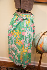 Herman Geist vintage floral skirt, vibrant green, pink, yellow, white pattern, side buttons.