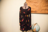 Vintage Betsey Johnson black floral dress with prominent tie front.