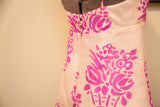 Vintage Betsey Johnson dress back, ivory fabric, fuchsia floral pattern, clear buttons.