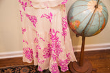 Betsey Johnson tiered ivory skirt with bright fuchsia graffiti floral print.