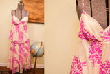 Ivory Betsey Johnson dress bodice close-up with fuschia floral pattern, skinny strap.