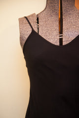 Betsey Johnson black slip gown with delicate V-neckline and thin shoulder strap.