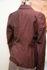 Back and side view of Alberta Feretti pinstripe jacket, highlighting red stitching and cuff buttons.