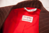 Alberta Feretti jacket's Philosophy label, Made in Italy tag, and bright red lining.