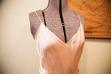 Vintage satin pink gown with V-neckline and delicate spaghetti straps.