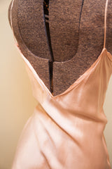 Vintage 1930s satin pink slip with elegant plunged V-back detail.