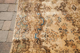 Textured pile of vintage Kerman rug, baroque motifs in ivory, blue, and sea foam green.
