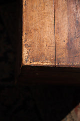 Aged cedar trunk's rustic wood surface showing time-worn texture and natural plank joinery.