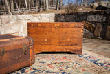 Vintage Cedar Blanket Chest Trunk, warm wood grain, exposed dovetail joints, boot cut footing.