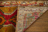 Plush red pile, whimsical patterns, and finely woven foundation of a Turkish rug.