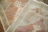 Plush blanched pile, woven foundation, and intact fringe of the Turkish rug runner.