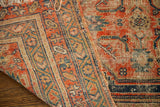 Aged edge of antique tribal rug, showing hand-knotted foundation and muted geometric pattern.