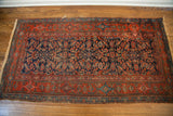 Kurdish runner's corner, showcasing fine Herati design, deep blue field, and worn red border.