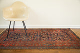 Vintage Kurdish rug runner, deep blue Herati design, richly hued terracotta borders, subtle wear.