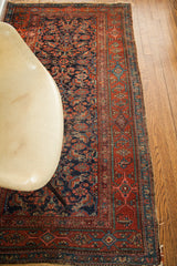 Vintage blue Kurdish runner with intricate herati pattern and a detailed red geometric border.