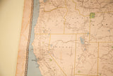 Vintage railroad map displaying western US states, pale colors, and visible water damage.