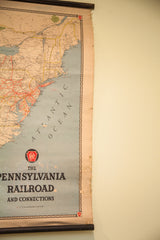 Vintage Pennsylvania Railroad map lower right, displaying title, logo, and aged edge.