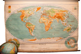 Vintage 1940s Denoyer Geppert pull-down world map with vibrant landmasses and blue oceans, 46x67 inches.