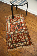 Aged fringe and distinct geometric motifs of a late 19th century Caucasian rug corner.