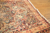 Distressed edge and floral motifs on a late 19th century Lavar Kerman rug.