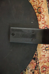 Mid Century Alvar Aalto side table underside, showing leg attachment with screws and patina.
