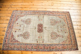 Lower right corner of the Laver Kerman rug, showing sea foam field and whimsical floral motifs.