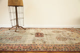 Antique Laver Kerman rug featuring whimsical coral patterns against a soft blue-grey field.