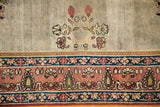 Late 19th century Laver Kerman rug: whimsical seafoam field flowers and stylized reddish-pink border.