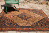 Antique Persian Senneh rug with a tight weave, low pile, and detailed Herati motif.