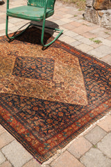 Antique Persian Senneh rug corner revealing the unique purple silk selvage and herati motif.